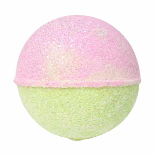 Bath bomb with pink top and green bottom on a white background scented in strawberry matcha